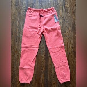 NWT and in original packaging: Men’s Essentials/Fear of God salmon sweatpants